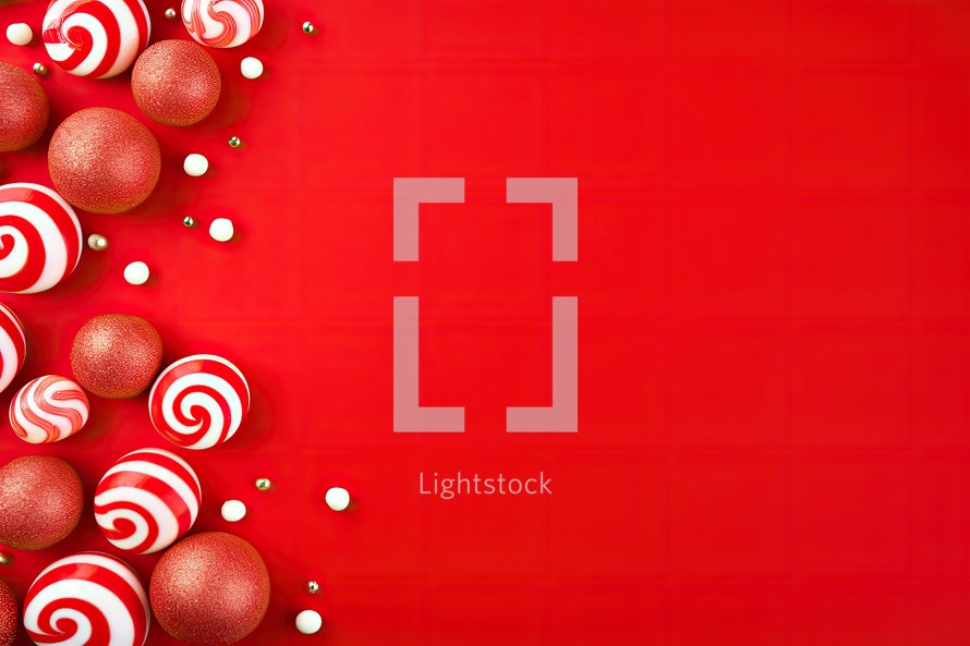 Christmas background with red and white candies on a red background.