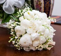 Bridal bouquet with white peonies and jasmine.