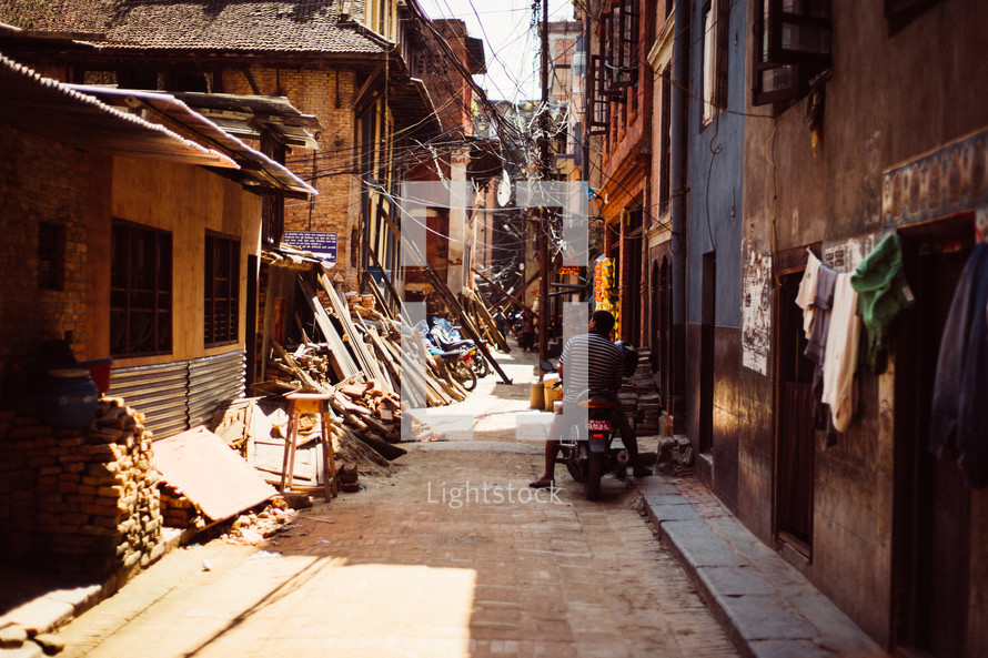 earthquake damage through an alley in Nepal 