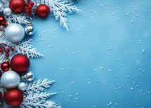 Christmas background with red and silver balls and snowflakes on blue
