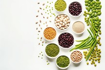 Variety of legumes in bowls on white background. Top view.