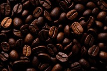 Coffee beans background. Roasted coffee beans closeup.