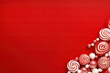 Christmas background with red and white candies and lollipops