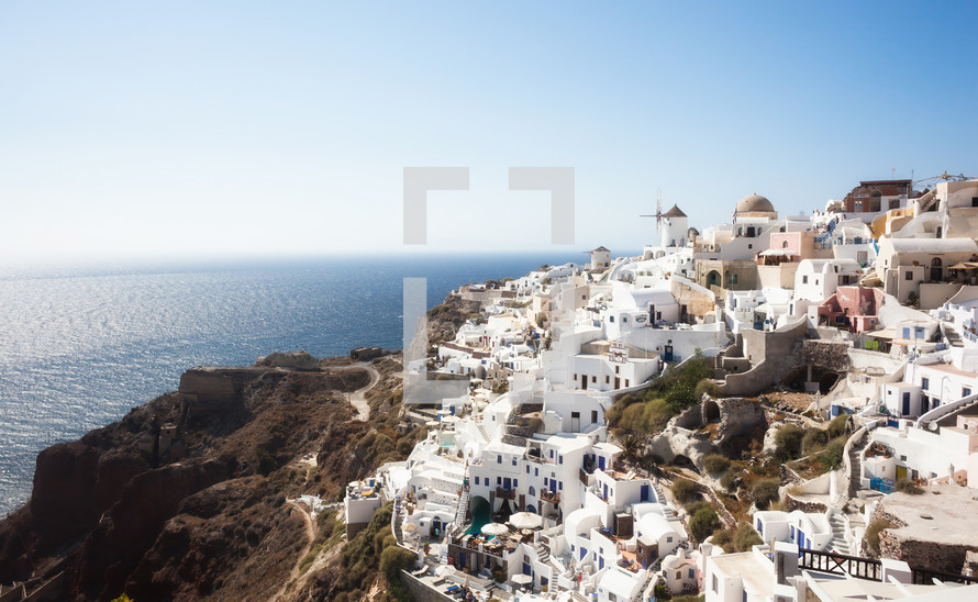Oia village, Santorini in Greece, view with windmills