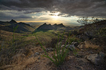 5 mountain peaks in an idyllic desert landscape at sunset