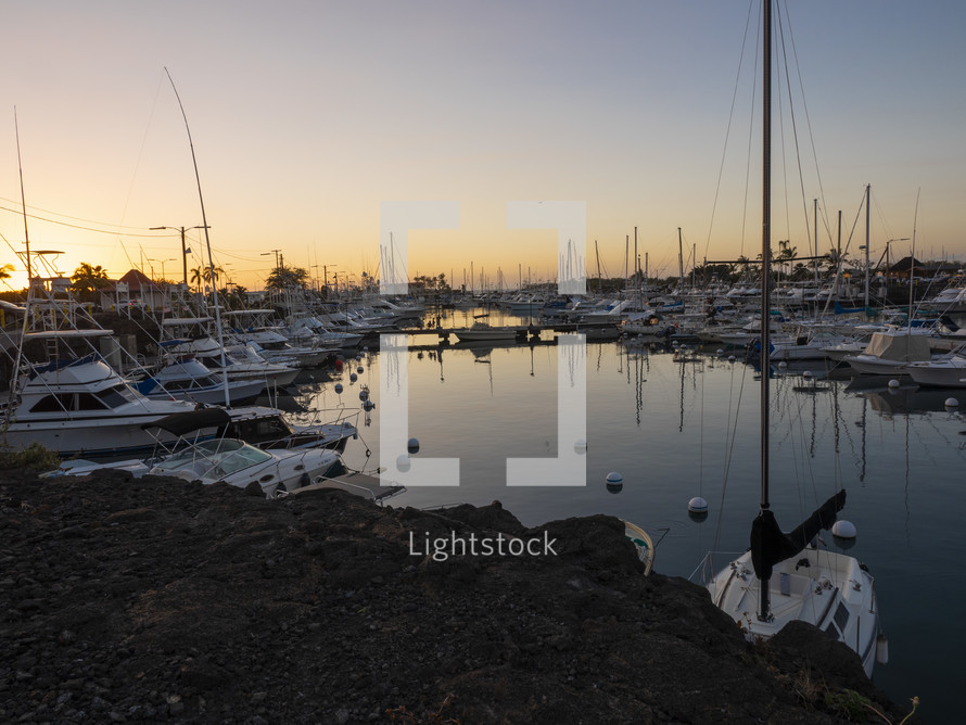 Many boats docked in a harbor