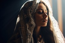 Portrait of a beautiful woman in a veil on a dark background