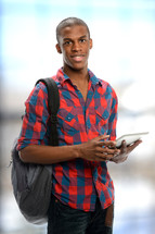 college student holding an iPad 