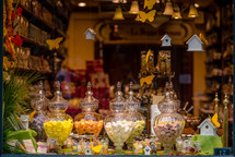candies in apothecary jars in a candy store 