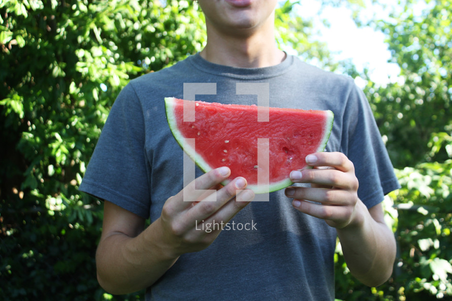a child eating a watermelon 