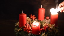 lighting three advent candles 