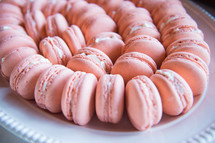 pink cookies on a tray 