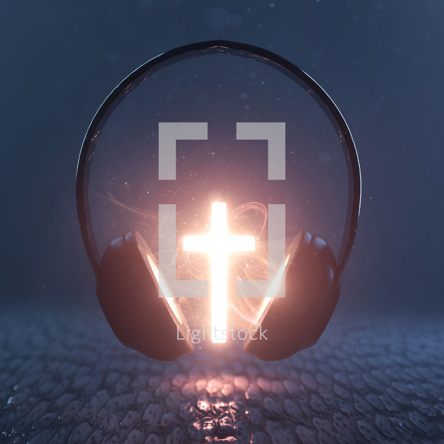 A bright glowing cross in the middle of a pair of headphones