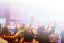 group worship and raised hands 