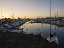 Many boats docked in a harbor