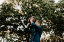 a young man with a basketball 