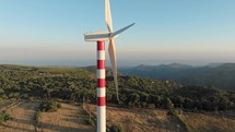Wind Turbine with red and white tower 