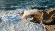 Powerful waves crashing into rocks