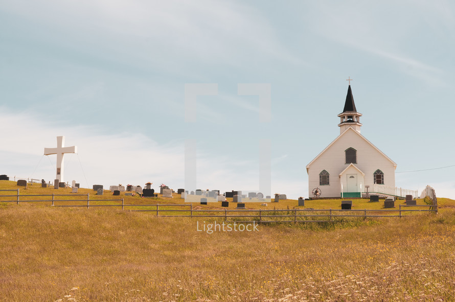 small white church and cemetery 