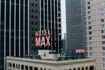 Hotel Max sign on the roof of a skyscraper 