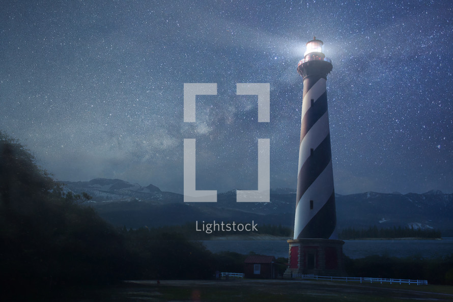 glowing lighthouse at night 