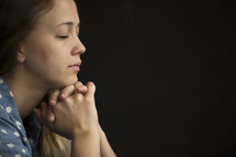 face of a woman in prayer 