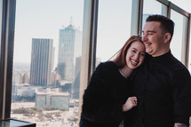 happy couple with a view of a city 