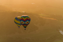 hot air balloons in the sky at sunset 