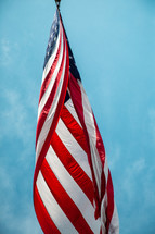 American Flag from below against bright bluw sky