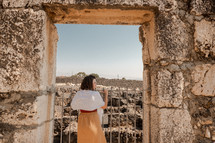 woman visiting ruins in Israel 
