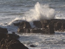 waves washing over rocks 