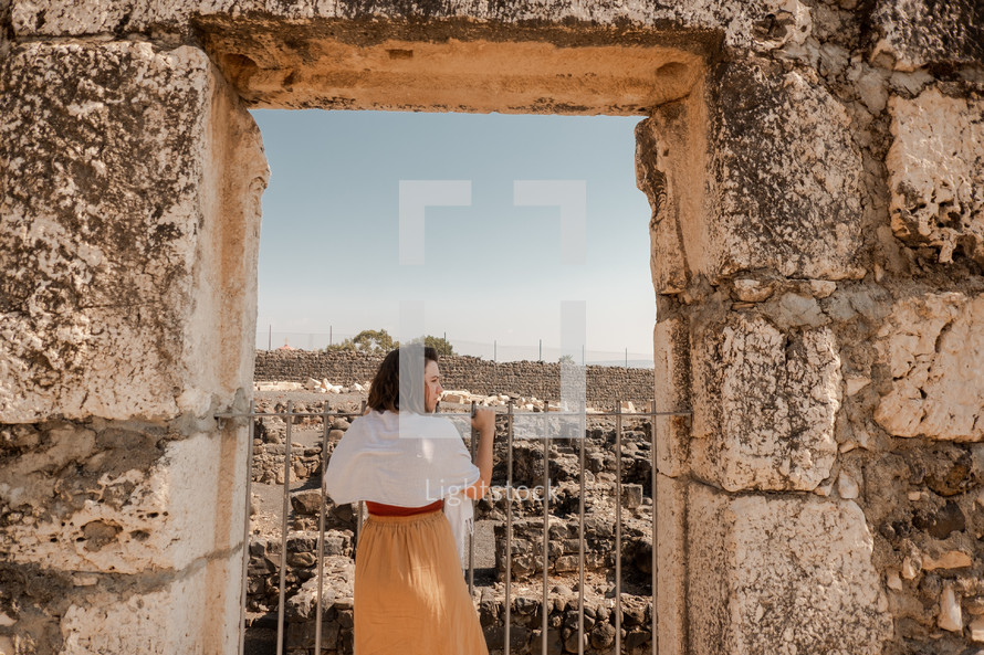 woman visiting ruins in Israel 