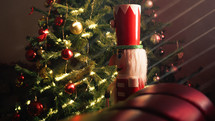 Nutcracker against On the side of Christmas tree