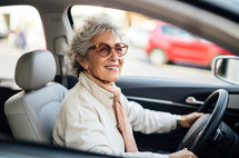 A 70-year-old Italian woman confidently driving a car