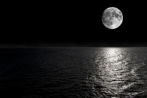 full moon over water at night 