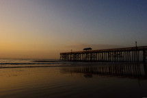 beach pier at dusk 