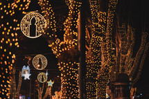 Illuminated trees and Christmas decorations in the street at night