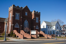 Red brick church with Christmas decorations in small town