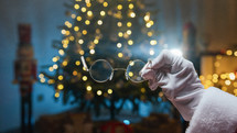 Santa Claus Clean his Eyeglasses to read letters