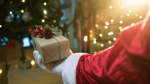 Santa Claus Hand Donate a Christmas Gift
