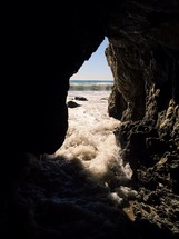 water rushing into a sea cave 