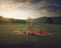 a woman lying in the grass, out of body, soul 
