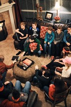youth at a Bible study sitting on couches in a living room 