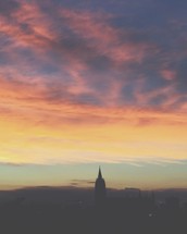 steeple in the sky at sunrise 