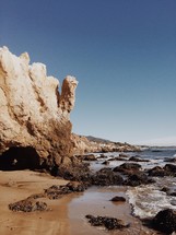 rock cliffs on a beach 