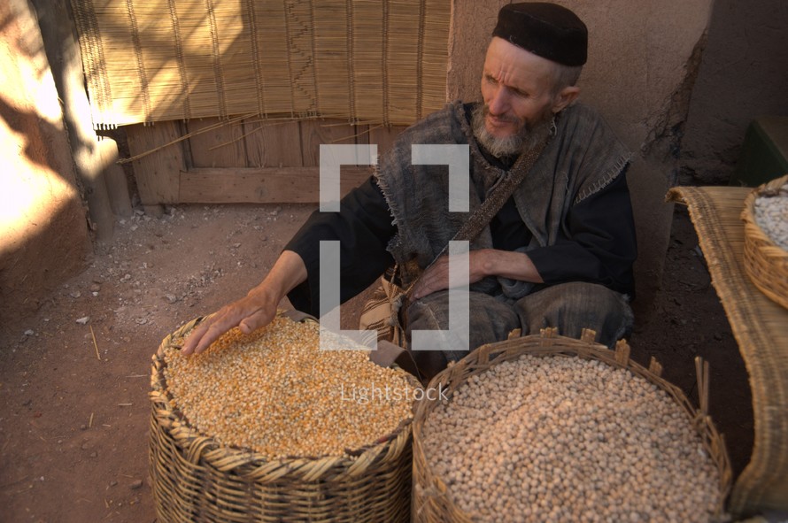 Vendor selling grains at the market in biblical times 