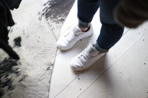 feet in white sneakers 