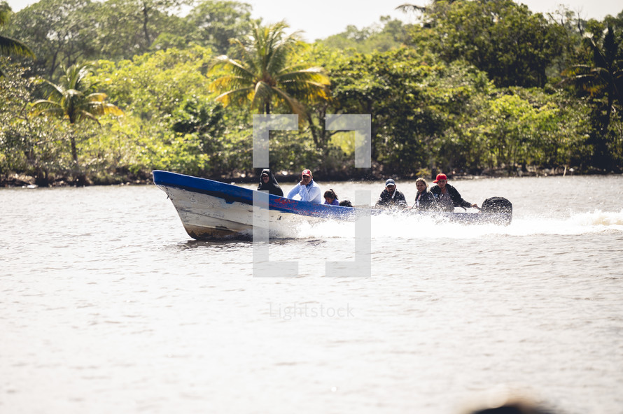 people on a boat in Honduras 