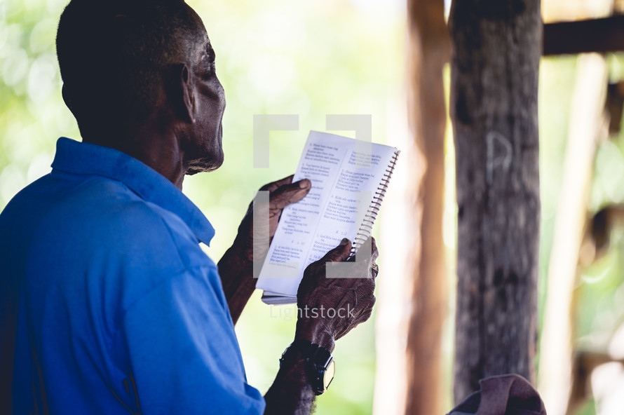 a man reading scripture in Honduras 