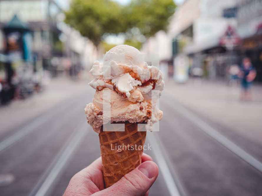 an ice-cream against a city backdrop